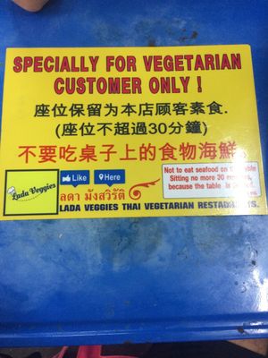 sign on the table at Lada Vegetarian Food - Veg Stall in Chiang Mai