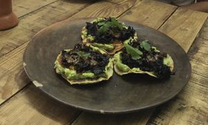 Tostadas de flor de jamaica con guacamole, salsa macha. at Pancho Maiz  in Merida