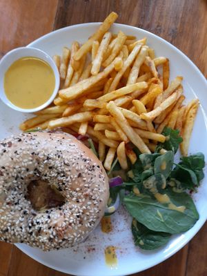 Portabello mushroom bagel, chips and salad, tahini dressing. at Dairy Lounge in Warwick