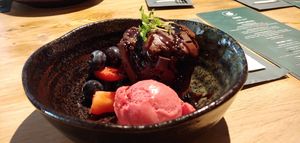 Vegan dessert. Chocoladecake met sorbetijs en fruit at Beautanica in Zwolle