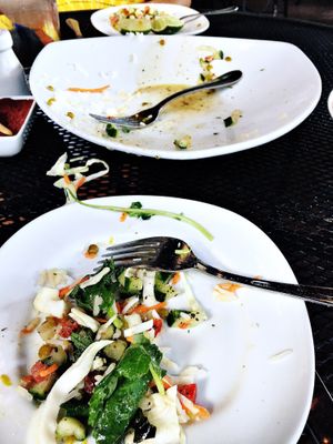 So hungry it was almost gone before the photo! The Specialty Salad.  at Pomegranate On Main in Greenville