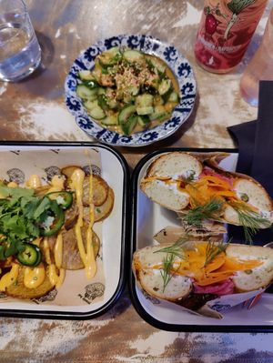 Carrot lax bagel/ Cox stock N Smokey. Side dishes Smashed cucumber, dirty skins potatoes. With local lemonade. Bagel was great structure enjoyed it. Cucumber side fun fresh side di at Yeastie Boi in Helsinki