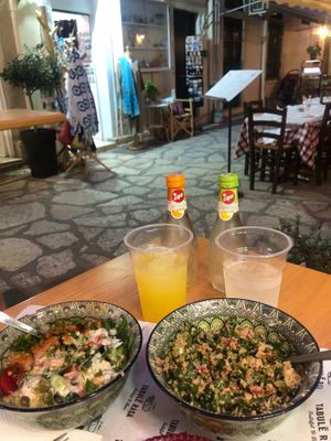 Potato salad and tabbouleh with lemonade and orangeade. at Tabule Rasa in Corfu