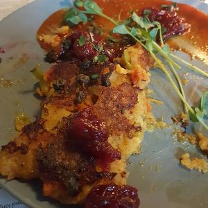Samosa cakes: samosa inspired potato + vegetable cakes, grilled. served with cranberry + orange chutney, spiced ketchup, fried shallots, pea shoots at Ollie in Ypsilanti