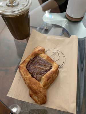 Something Blue iced coffee with a cream cheese and cherry danish 😋  at Gallivant Coffee in Woodfin