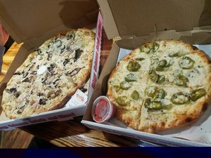 vegan chicken and garlic pizza with Follow Your Heart mozz and jalapeno garlic cheeze bread! at Rudy's Pizza in Portland