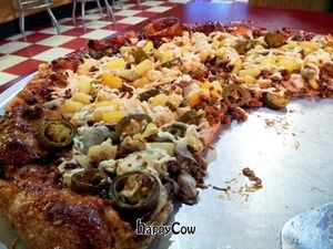 Bbq sauce base, topped with Daiya, mushrooms, artichoke, jalapeno, pineapple, and sorta-sausage.  So freaking good. at Rudy's Pizza in Portland