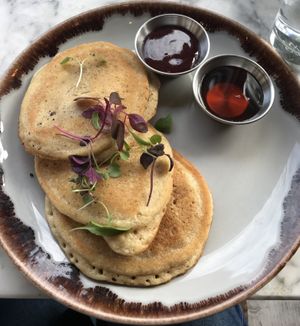 Pancakes with berry compote  at Oscar Bar & Kitchen in Glasgow