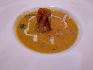 Sweet potato Asian-inspired soup with a pumpkin seed fried wonton. at Lucky Leek in Berlin