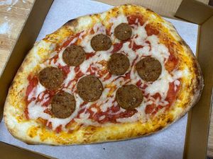 Miyoko's pizza shop mozzarella, the very good butcher pepperoni, and house made fermented dough and house pizza sauce.  at Off Center Patio & Pub in Hilliard