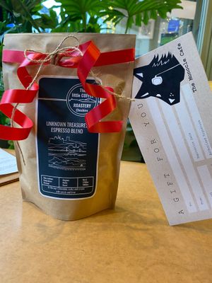 Coffee beans and gift cards for sale at The Monocle Cafe in Macclesfield