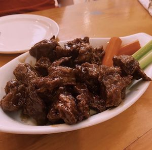 Wings covered in maple syrup and garlic sauce  at Rise Above in St Catharines