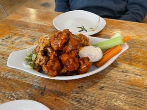 The seitan wings. Half are Sriracha lime, half are buffalo sauce. In the container is the lemon aïoli sauce.  at Rise Above in St Catharines