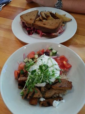 Seitan souvlaki bowl, and smoked beet reuben with potato wedges. YUM. at Rise Above in St Catharines