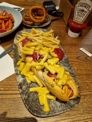 Moving Mountains hot dog with mac and cheese and fries. Plus vegan friendly onion rings at The Braes in Dundee
