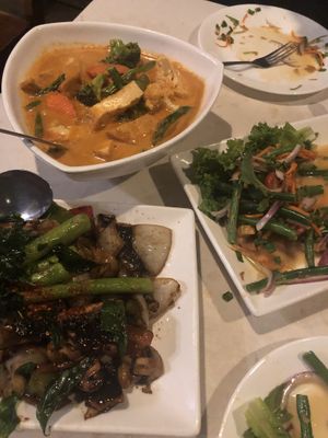 Top left: “Noodle Curry” - coconut curry with tofu, carrots, broccoli, asparagus, cauliflower. Bottom left: Seitan beef with 3 mushrooms at Araya's Place - University District in Seattle
