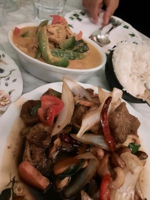 Stir fry and a curry with tofu and coconut rice at Poppy's Thai Eatery in West London