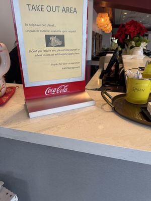 Sign at the cashier desk  at Asian Wok n Roll - Millcreek Dr in Mississauga