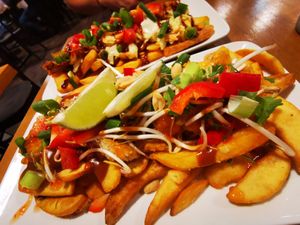 Fries chicken peanut sause and fries pulled pork. Verry tasty😊 at Café Gold in Kiel