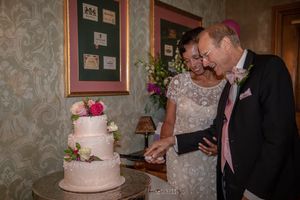 Cutting the beautiful cake!  at UpRising bakery & cafe in Lake In The Hills