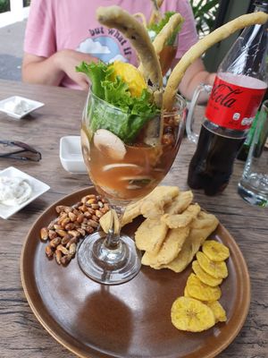 Leche de tigre with crispy corn, chicharron and fried plantain crisps at El Chino Vegano in Lima