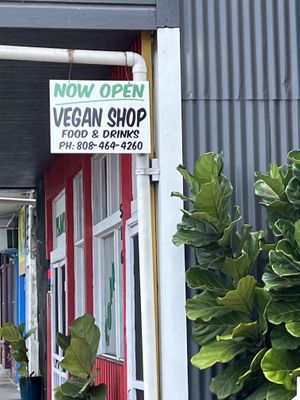 Sign as viewed from the road    at The Vegan Shop in Hilo