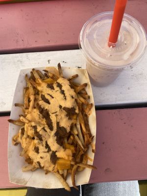Loaded vegan fries and a vegan strawberry shake!  at Herbie's Burgers in Albany
