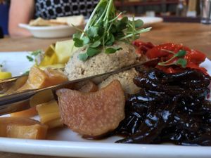 Paté Platter: Lentil-pecan paté, red onion confit, house made pickles, croccantini, fresh fruit. at Cafe Flora in Seattle