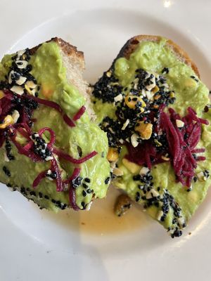 Avocado toast with pickled beets, nigella seeds, and pistachios   at Cafe Flora in Seattle