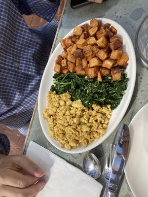 Tofu potatoes and garlicky greens that my omnivore husband loved    at Cafe Flora in Seattle