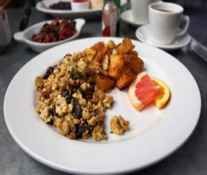 vegan summer mushroom scramble: scrambled tofu with spring onions, grilled cremini mushrooms, fresh tarragon and chives. at Cafe Flora in Seattle