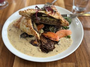 Mushroom Wellington with seared brussel sprouts, mashed potatoes and rapini.   at Cafe Flora in Seattle
