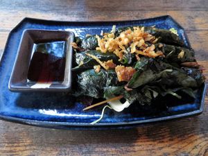 Vietnamese stater: tofu, mushrooms and vegan "duck" wrapped in (can't remember) leaf. Super tasty sauce too! at Rou Vegan in Berlin
