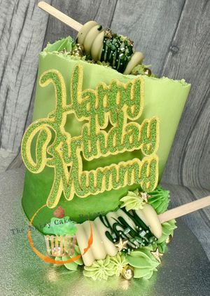 Beautiful green chocolate cake with matching cake pops at The Nakey Cakey Bakery in Castletown