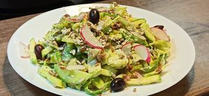 Salad with iceberg, red rice, cucumbers, courgettes, radish, olives and dill dressing at Vitu Kitchen - кухня ВИТУ in Plovdiv