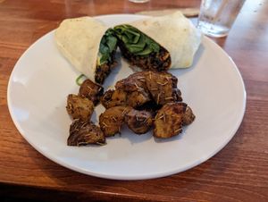 Plant based chorizo burrito with rosemary potatoes. The potatoes were very salty, but the burrito was amazing! at Lucy in the Rye in Sylva