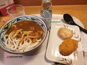 Vegan curry with udon, pumpkin karokke, sweet potato tempura, ramune at Marugame Udon in East London