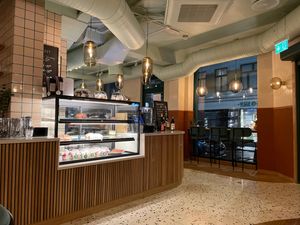 Entry area with deserts on the left shelf   at Cultivate Food in Oslo