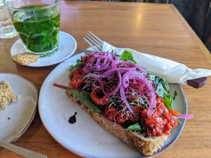 Roasted red pepper sandwich. On the left what is left of a chocolate banana bread. at Buna Koffiebar in Castricum