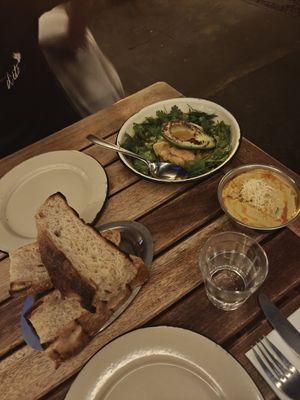 Focaccia, charred avovado with kimchi and peanut soup — HIGH recommendation for all of these! at Chuí in Buenos Aires