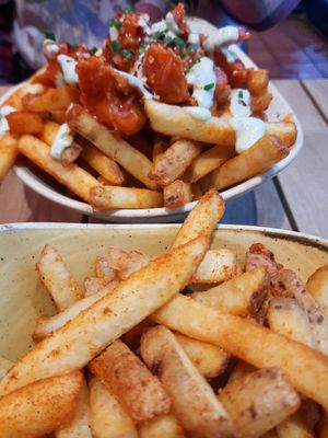 Back: wings and fries with buffalo; front: paprika fries at Herbivorous - Withington in Manchester