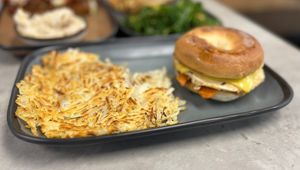 “Egg” Breakfast sandwich perfectly paired with hash.  at Vegas Vegan Eatery in Las Vegas