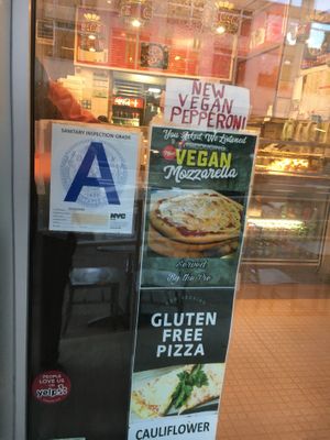 Placard for vegan pizza pies. at Pizza Park in New York City