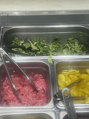 arugula that comes on the vegan heat & it’s full of cheese   at &pizza in Union