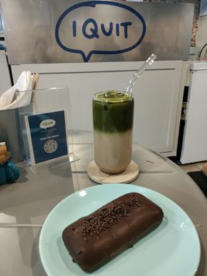 Horchata matcha and cake covered in chocolate with cream and jam inside at I Quit - Café & Bakery in Mexico City