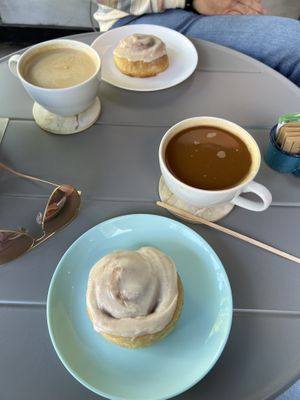 Cinnamon buns. Opposite - latte with oat milk, near - americano with coconut milk.   at I Quit - Café & Bakery in Mexico City