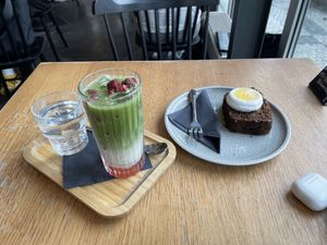 Raspberry matcha latte and some cake  at Cafedu in Prague