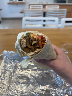 Grilled C Wrap- Grilled vegan chick'n, grilled onions, cabbage, carrot, lettuce, tomato, with 1000 Island dressing. Wrapped in a flour tortilla.  at Envegan in East Point