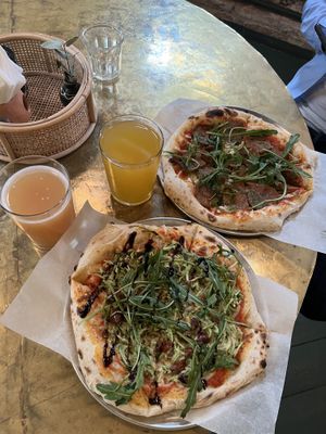 Pizza with squash and pesto and with pepperoni + cider and kombucha  at KOM in Moscow
