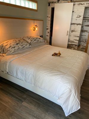 Comfy bed with little stuffed deer to greet us. at Deer Run Bed and Breakfast in Big Pine Key